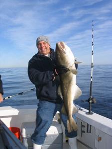 Dan Potter with a nice 30 LB steaker cod he caught using a clam aboard RELENTLESS